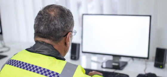 Police officer at computer